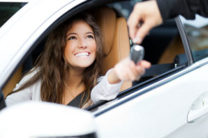 Happy Woman In New Car Given Keys By Dealer